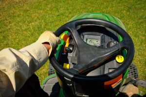 What causes a riding lawnmower to cut uneven